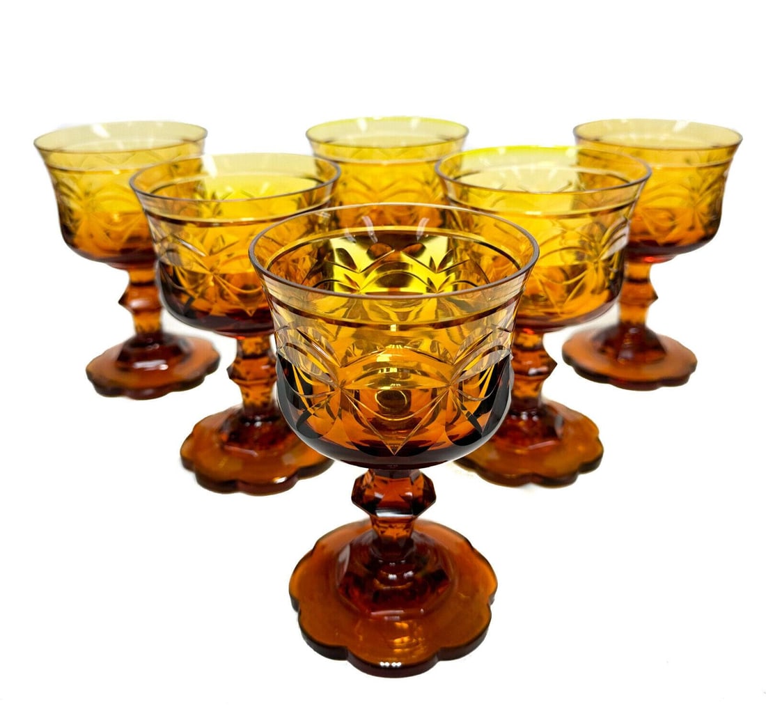 6 Bohemian Amber Gold Cut Glass 8 ounce Water Goblets, 19th Century: 6 Bohemian amber gold cut glass 8 ounce water goblets, 19th Century. Bisected oval motif with a scalloped petal base. Pontil underside. Weight Approx., 4 lbs Measures Approx., 3.9 inches diameter x 6
