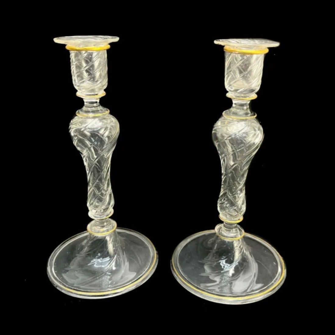 Pair Lobmeyer Germany Swirled Glass and Gilt Candlestick Holders circa 1900: Pair Lobmeyer Germany Swirled Glass and Gilt Candlestick Holders, circa 1900. Swirled texture to the stem. Gilt trims to the top and base rim. Weight Approx., 1 lb Measures Approx., 4.5 inches diamete