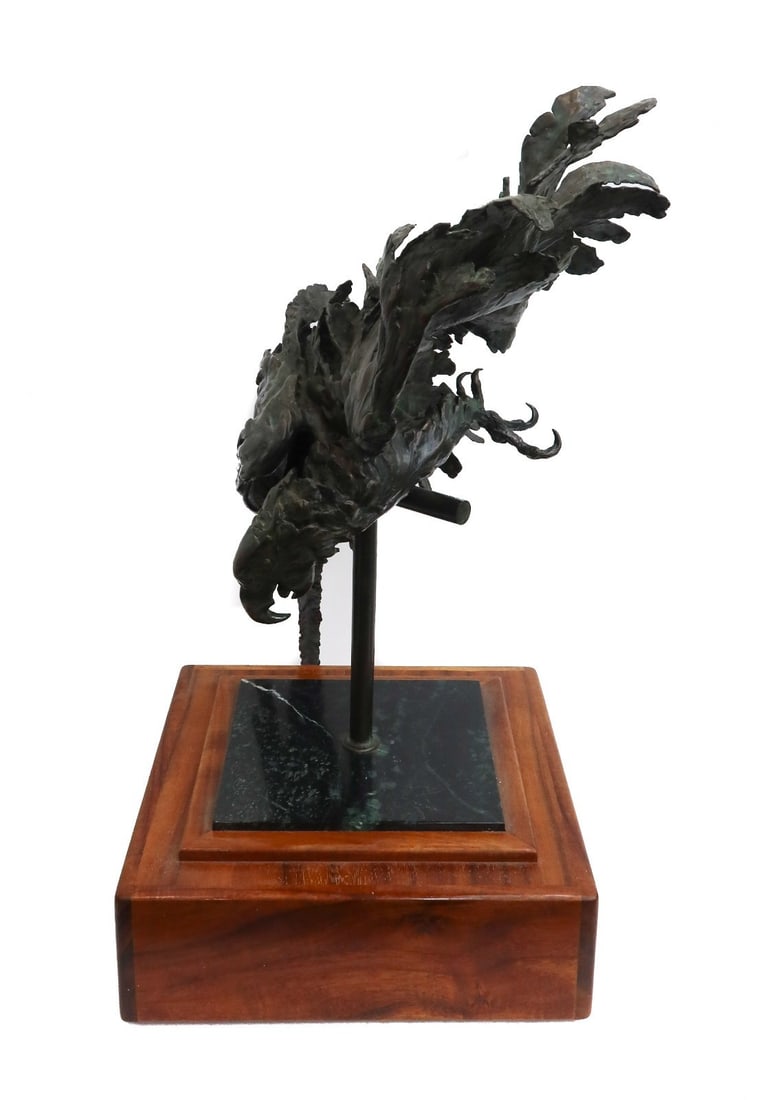 Sandy Scott (American b1943) Bronze Sculpture Parrot on Perch Ltd Ed 5/25 1982: Sandy Scott (American b. 1943) Bronze Sculpture Parrot on Perch on Wood Base. Artist signed and numbered out of 5/25 to interior feather. Mounted on a square wood base Weight:approx. 55 lbs Measuremen