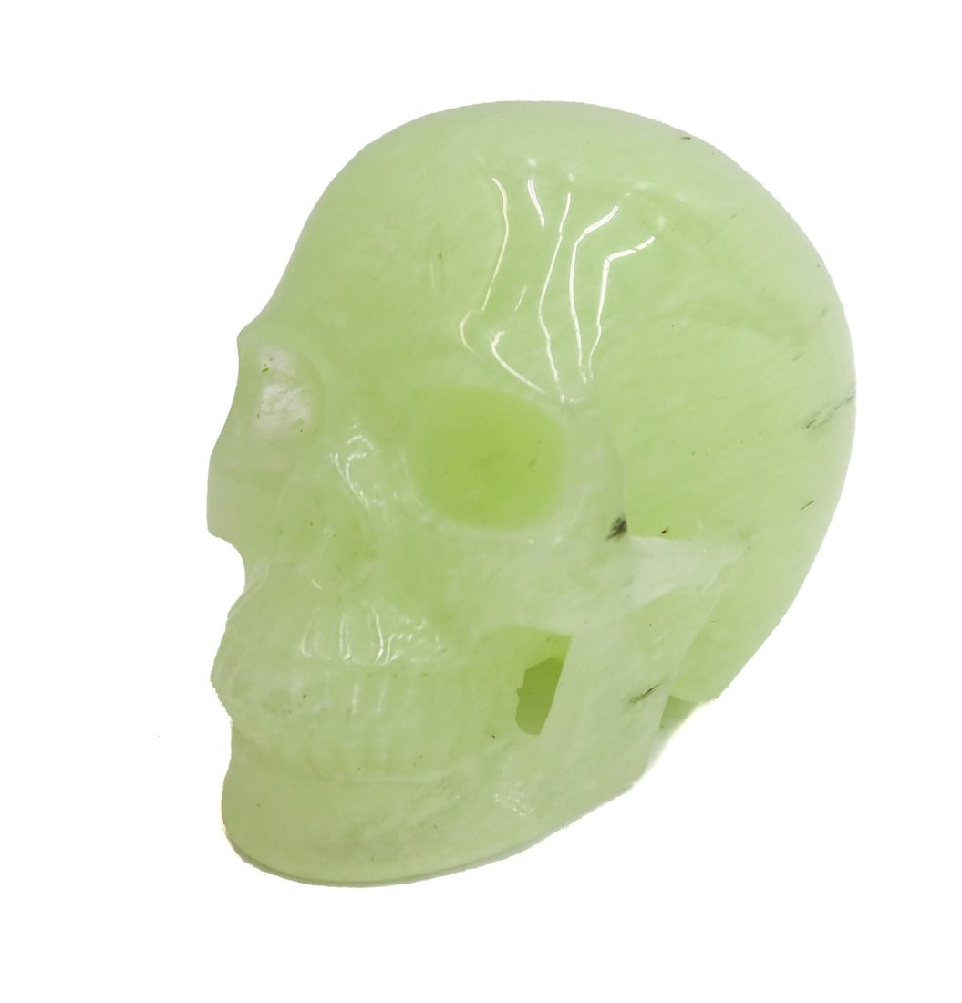 Carved Green Calcite Skull Figurine 20th Century: Carved Green Calcite Skull Figurine. 20th Century Weight: Approx. 2lbs Measurements: Approx. 5 inches x 3.25 inches x 3.5 inches tall Condition: Great condition. No apparent condition issues. Domestic