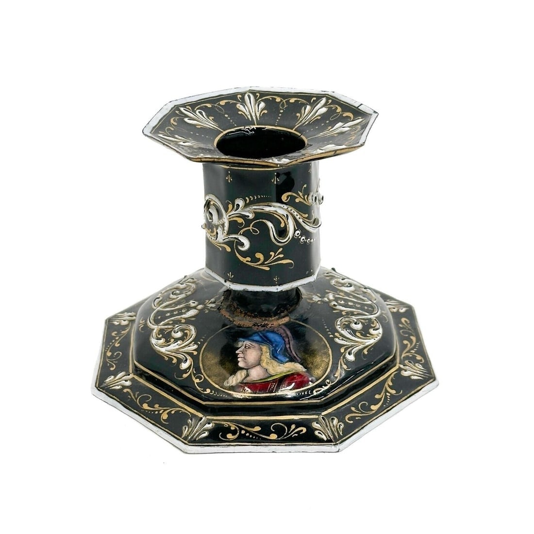 Limoges Enameled Candlestick Holder Black Painted Portraits 19th century: Limoges France Enameled Candlestick Holder, 19th century. A black ground decorated with white and gilt foliate decoration, portraits to the base. Weight: Approx. .5 lb Measurements: approx. 5.5 inches