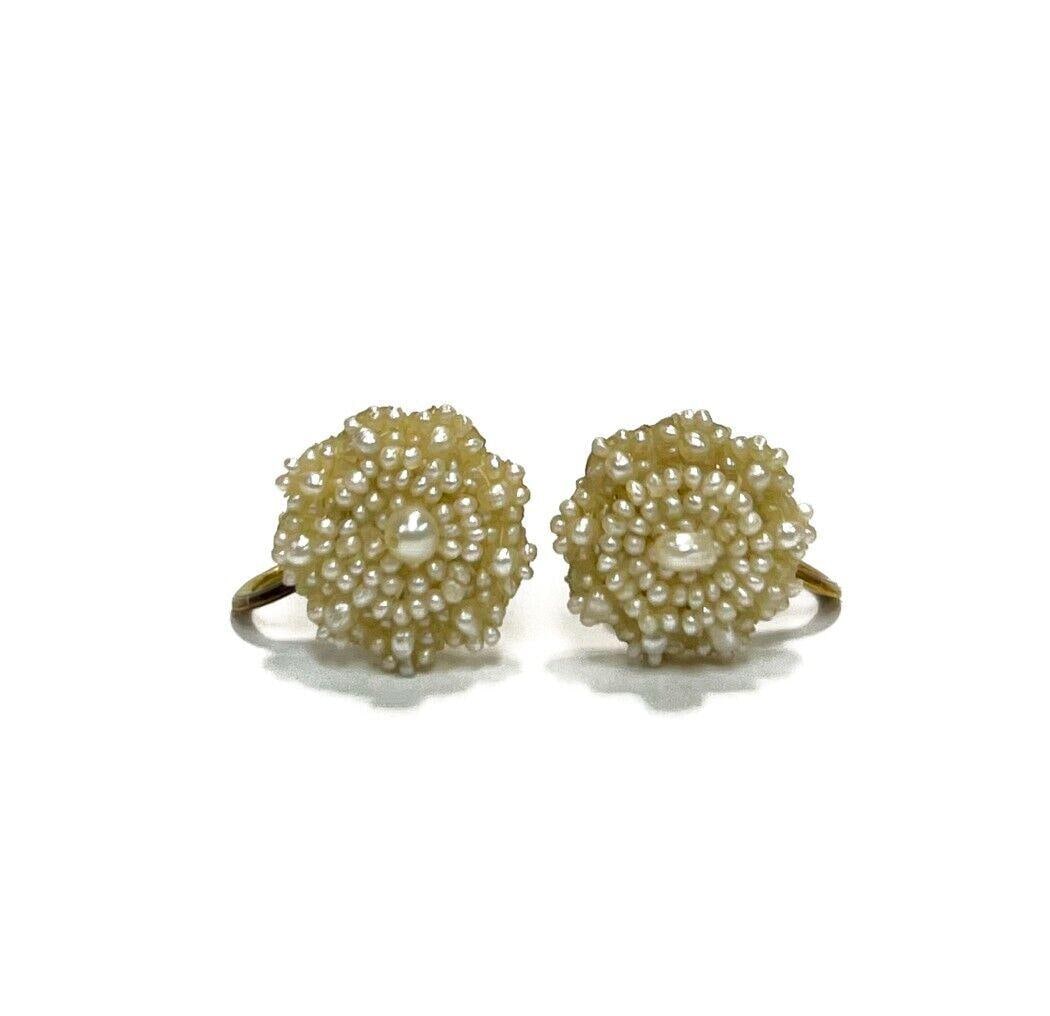14k Yellow Gold Seed Pearl Floral Earrings: Victorian 14k Yellow Gold Seed Pearl Floral Earrings. The face resembling a flower. Marked "14k" to backing Weight Approx., 2.43 grams Weight Approx., 0.5 inches x 0.625 inches x 0.6 inches Domestic S