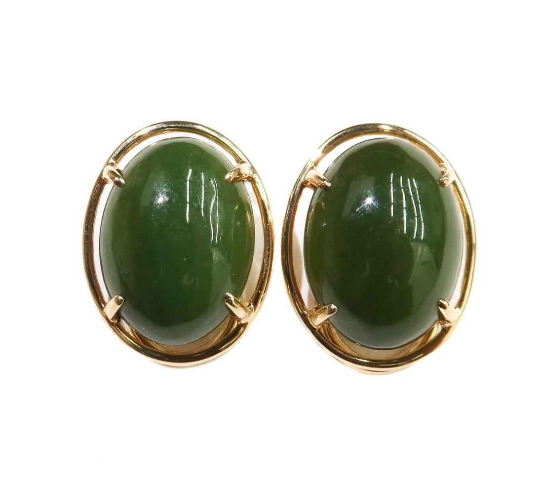 Gump's 14k Yellow Gold Cabochon Jade Clip on Earrings: Gump's 14k Yellow Gold Cabochon Jade Clip on Earrings. The jade measuring approximately 16mm x 12mm x 5.6mm. Marked Gump's 14k to back. Weight Approx., 8.72 grams Measures Approx., 0.75 inches x 0.6 i