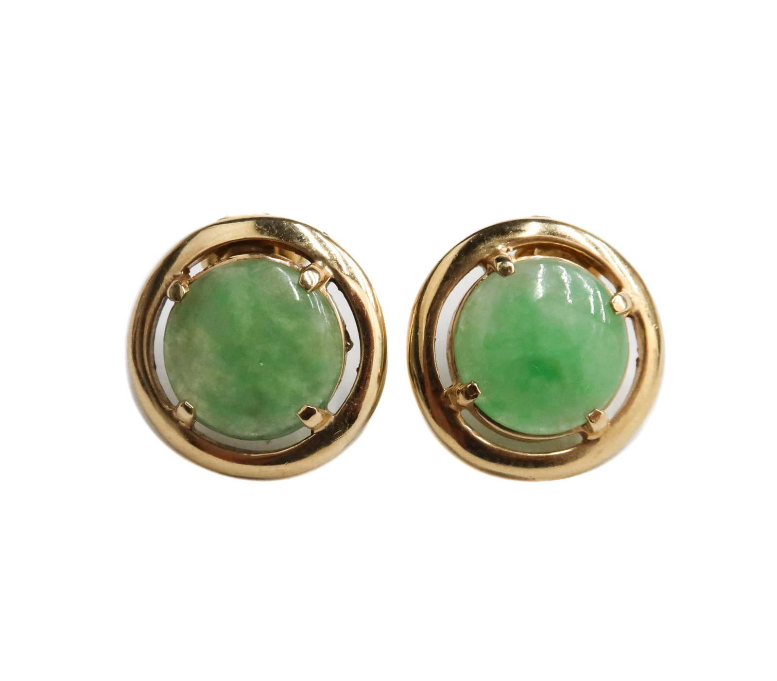 14k Yellow Gold and Jade Earrings: 14k Yellow Gold and Jade Earrings. Round cabochon cut green jade measuring approximately 10.31mm x 2.37mm. Marked "585" to backing. Weight Approx., 4.89 grams Measures Approx., 0.5 inches diameter x 0