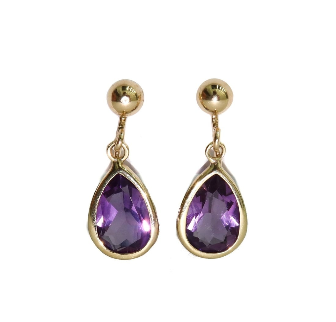 14k Yellow Gold and Bezel Amethyst Pear Dangle Twist Back Clip Earrings: 14k Yellow Gold and Bezel Amethyst Pear Dangle Twist Back Clip Earrings. Amethyst measures approx., 8.9mm x 6.5 inches x 4.5 inches and weighs roughly 2.48 carats total. Marked 14k to backings. Weight