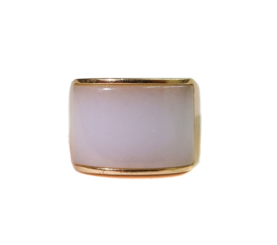 14k Yellow Gold and White Jade Ring Size 5.5: 14k Yellow Gold and White Jade Ring Size 5.5. Cabochon rectangular cut white opal measuring approximately 17.2mm x 11 mm x 5.3mm. Marked 14k. Weight Approx., 9.29 grams Measures Approx., Size 5.5 Dome