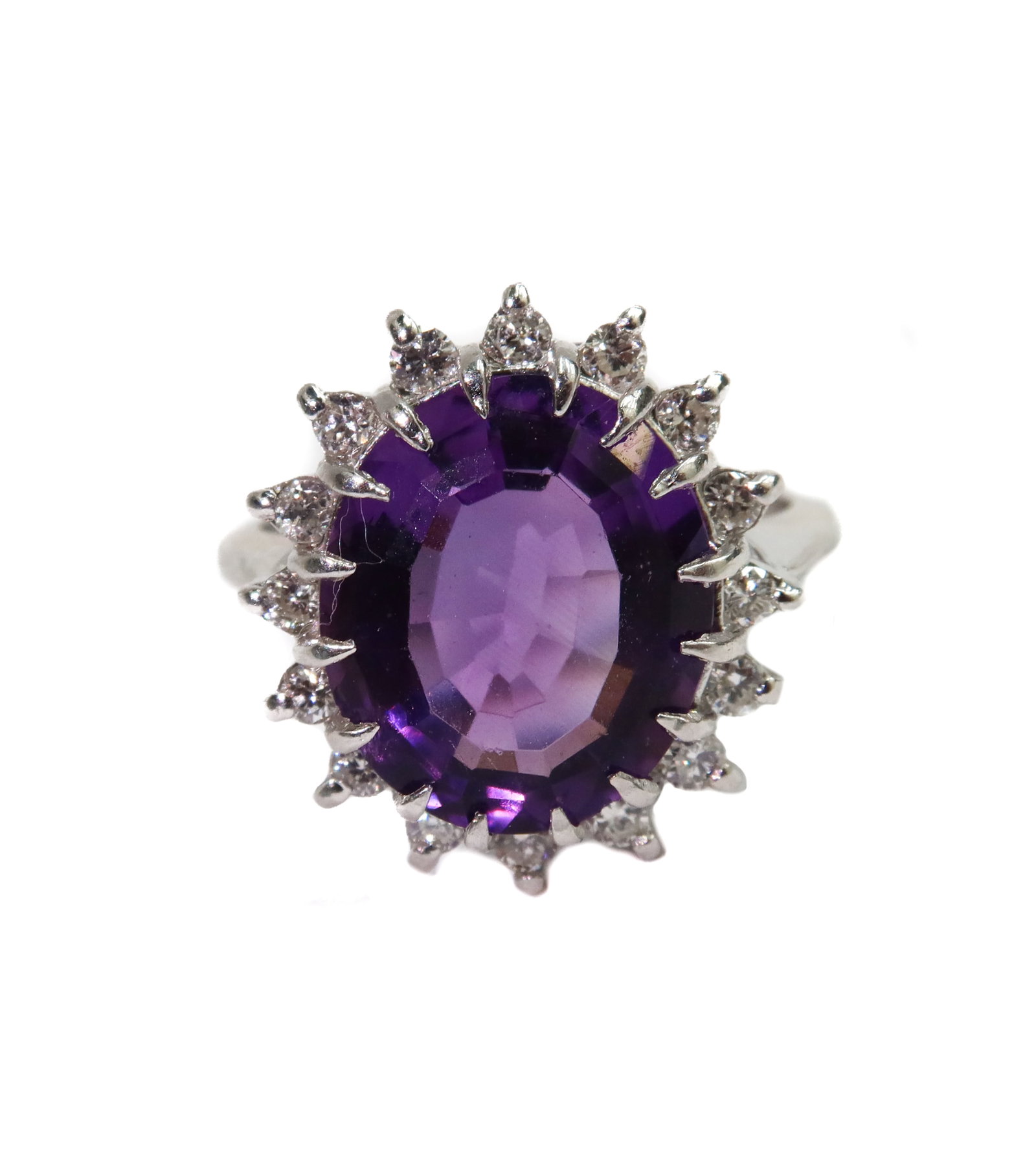14k White Gold Amethyst and Diamond Ring Size 8.5: 14k White Gold Amethyst and Diamond Ring Size 8.5. Oval cut amethyst measures approximately 13.93mm x 12.24mm x 5.61mm and weighing around 5.07 carats. 16 round cut diamonds weighing approximately 0.3