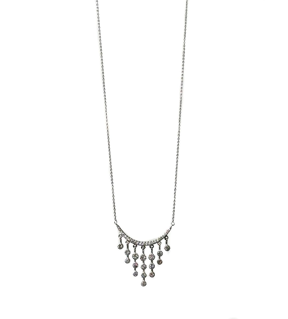 14k Yellow Gold and Diamond Curved Drop Necklace: 14k yellow gold and diamond curved drop necklace. 39 round cut diamonds to the drop curve pendant weighing 0.34 carats. Marked "14k" and "585" to clasp. Weight: Approx. 2.92 grams Measurements: Approx