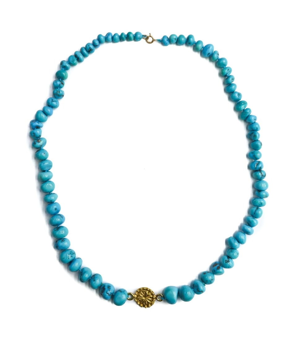 22k and 14k Yellow Gold Graduated Turquoise Beaded Necklace: 22k and 14k Yellow Gold Graduated Turquoise Beaded Necklace. Graduated turquoise measuring from 5.5mm to 12.1mm. Gold floral pendant to center testing for at least 22k and marked 14k to clasp. Weight: