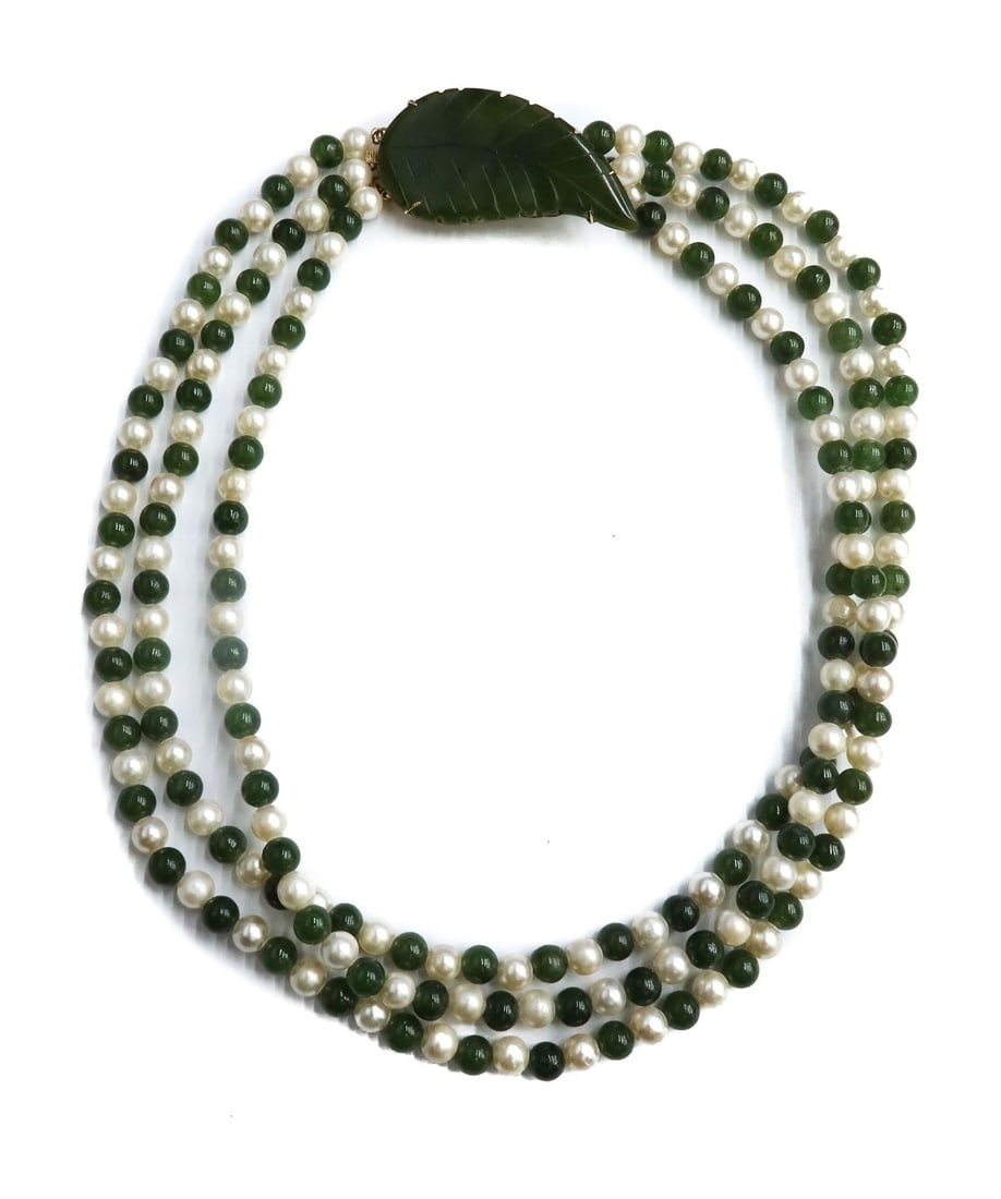 10k Yellow Gold Cultured Pearl and Jade Triple Strand Necklace: 10k Yellow Gold Cultured Pearl and Jade Triple Strand Necklace. Cultured pearls alternating with jade beads measuring approximately 6.1mm. Carved leaf to clasp. Gold tests for 10k Weight Approx., 76.8
