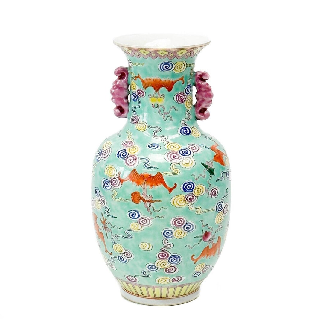Chinese Hand Painted Enameled Porcelain Handled Vase Blue with Swirls: Chinese Hand Painted Enameled Porcelain Vase. Figural twin handles. A blue ground with swirl decoration. Underside with blue stamp mark. Weight Approx., 2 lbs Measures Approx., 4.5 inches diameter x 8