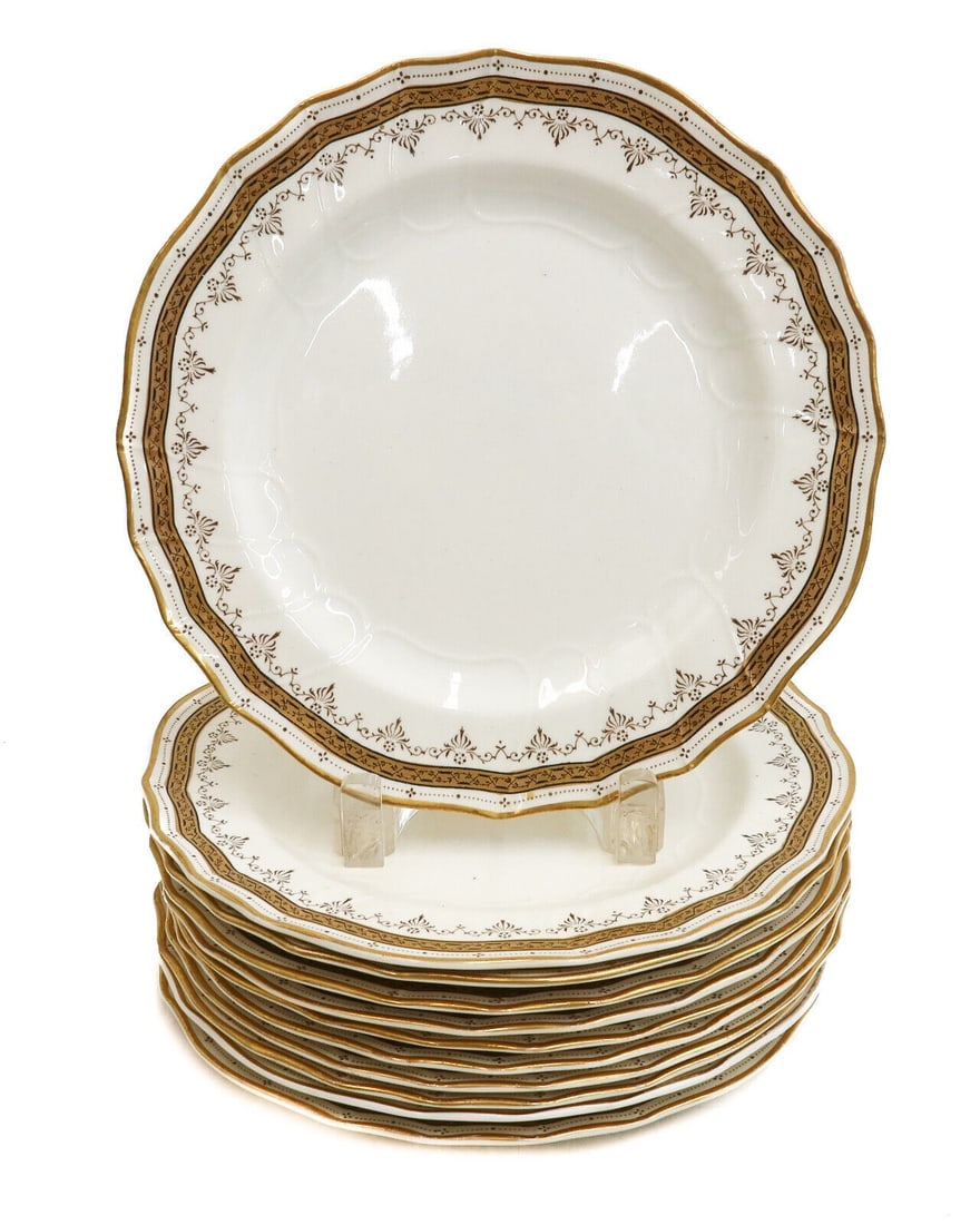 11 Cauldon England Porcelain and Gilt Scallop Rimmed 9 inch Plates late 19th C: 11 Cauldon England porcelain and gilt scallop rimmed 9 inch plates, late 19th Century. Scallop rim with gilt decorations to edge. Cauldon mark to underside with English registration marks for Septembe