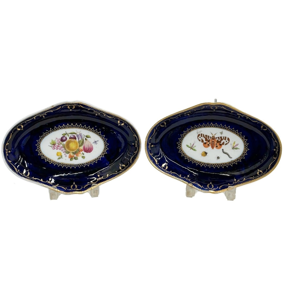 Pair Coalport English Hand Painted Porcelain Oval Dishes Fruits Insects c1820: Pair English Hand Painted Porcelain Oval Dishes circa 1820. A cobalt blue ground with gilt accents, hand painted fruit bouquet to center of one, insects to the other. Apparently unmarked, attributed t