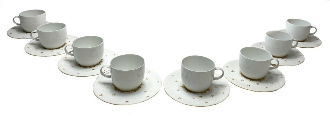 8 Rosenthal Magic Flute Papageno Gilt Porcelain Cup & Saucers: 8 Rosenthal Magic Flute Papageno cup and saucers with gilt design around saucers. Studio line by Bjorn Wiinblad. Weight Approx., 4 lbs Measures Approx., Cup: 2.9 in. diameter x 2.5 in. tall/ Saucer: 6