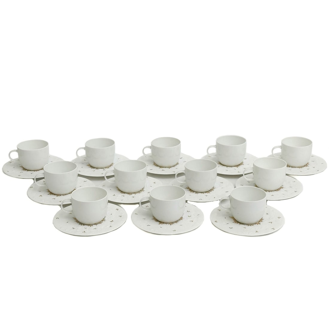 12 Rosenthal Porcelain Magic Flute Papageno Gold Accents Tea Cup & Saucers: 12 Rosenthal Germany Magic Flute Papageno Tea Cup & Saucers. Saucers with a white ground with raised ornate decoration of figures to the rim, gilt accents. Underside marked Rosenthal Germany Bjorn Wii