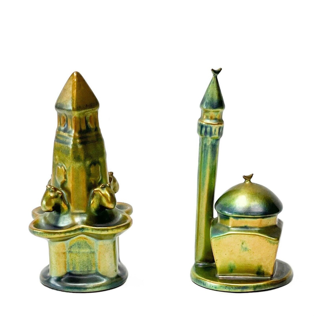 Pair Zsolnay Hungary Iridescent Green Eosin Glaze Porcelain Figurines Buildings: Pair Zsolnay Hungary Eosin porcelain figurines, circa 1925. One depicting a mosque with a minaret, the other depciting a vintage fountain. Iridescent green eosin glaze. Both with Zsolnay marks to the 