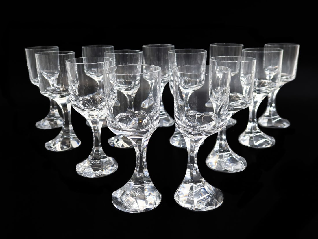 13 Baccarat France Crystal Glass Red Wine Goblets in Narcisse: 13 Baccarat France crystal glass red wine goblets in Narcisse. Modernist off center bowed stem. Acid etched baccarat mark to underside. Weight: Approx. 12 lbs Measurements: Approx. 2.625 inches diamet
