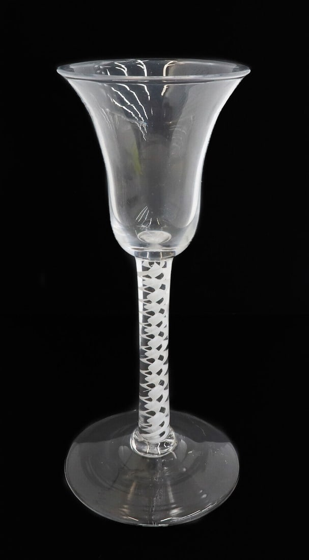 English Georgian Air Twist Glass Wine Glass Goblet, 18th Century: English Georgian Air Twist wine glass goblet, likely 18th century with a rough pontil. White lattice striped air twist decoration to the stem. Weight: Approx. 0.25 lb Measurements: Approx.2.75 inches 