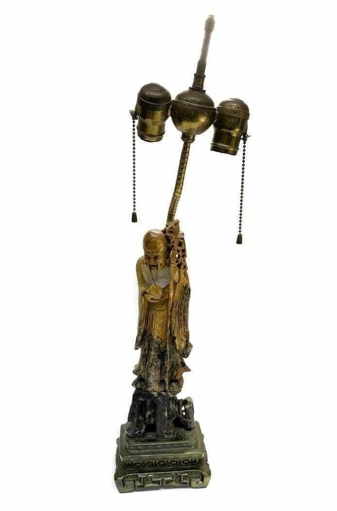 Chinese Hand Carved Buddha Two Light Lamp: Chinese Hand Carved Soapstone Buddha Two Light Lamp. Very finely hand carved Buddha to figure, mounted to a gilt metal base. Figure converted to a lamp likely in the 1st quarter 20th Century. Weight A