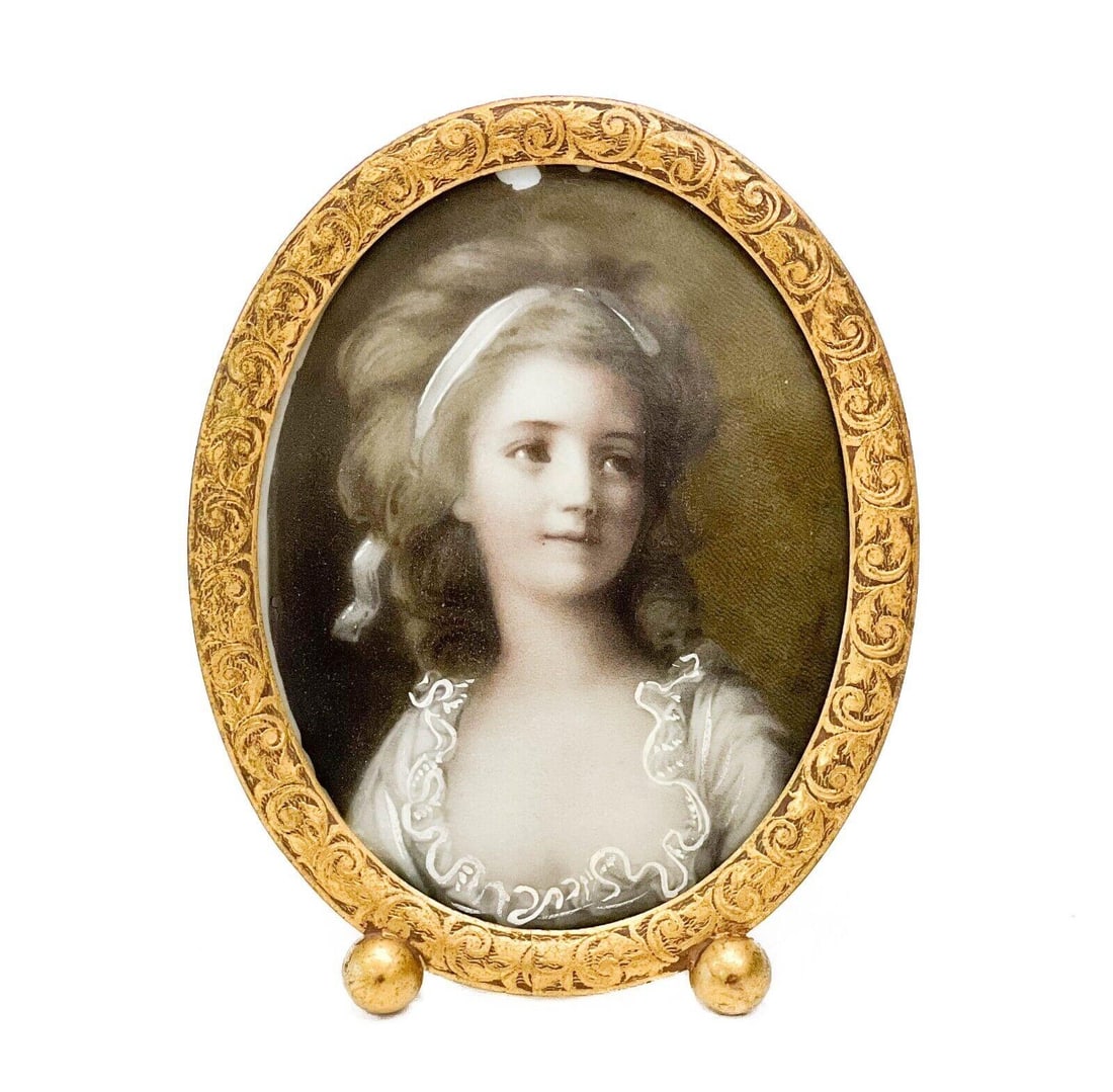 Miniature Portrait Painting Porcelain Plaque of a Woman, Framed: Portrait miniature painting porcelain plaque of a woman, framed. Image depicts a portrait of a young woman. Apparently unsigned, in a gilt frame. Frame circa 1900, plaque likely early 20th century. Po