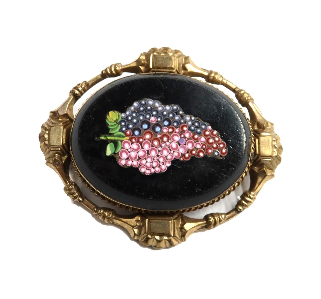 19th Century Gilt Metal Micromosaic Pendant Brooch Two Tone Grapes: 19th Century gilt metal micro-mosaic pendant brooch. Two tone purple grapes to center. Gilt metal frame. Weight: Approx. 19.24 grams Measurements: Approx. 2.25 inches x 1.75 inches x 0.4 inches Condit