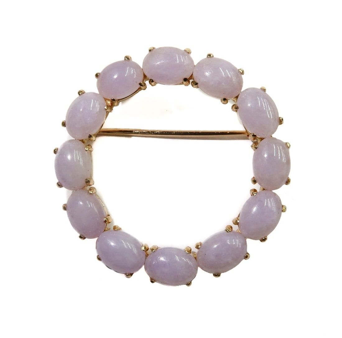 Gump's 14k Yellow Gold Cabochon Lavender Jade Pin Brooch: Gump's 14k yellow gold cabochon lavender jade pin brooch. 12 cabochon lavender jades measuring approximately 6.8mm x 5.2mm x 3mm. Marked Gump's 14k to back frame. Weight: Approx. 7 grams Measurements: