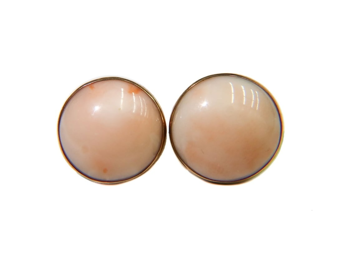 Pair 14k Yellow Gold Coral Earrings: Pair 14k Yellow Gold Coral Earrings. Coral Earrings. Coral measuring approximately 12.1mm. Marked 14k gold Weight Approx., 5.67 grams Measures Approx., 0.525 inches diameter x 0.75 inches Domestic Shi