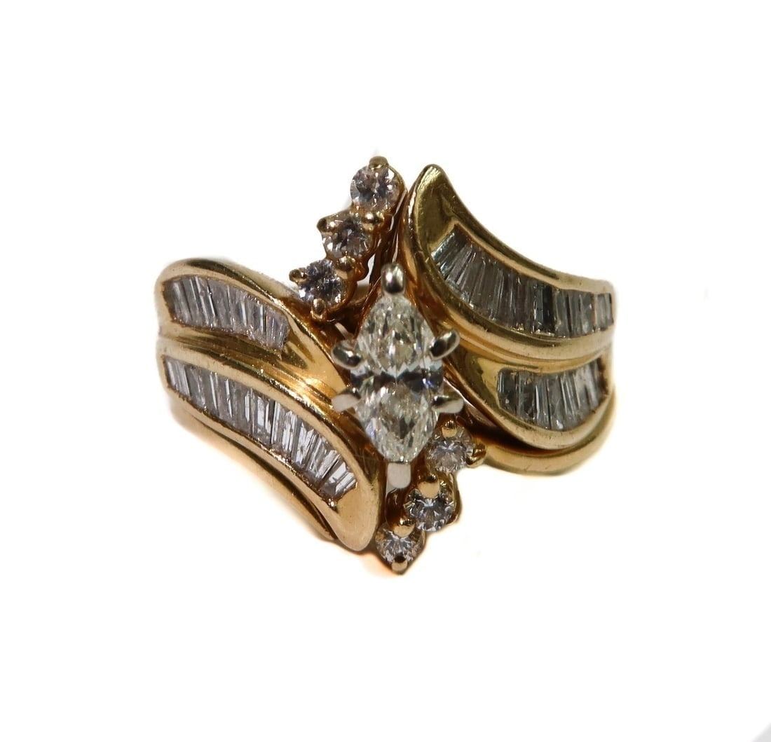 ODI 14k Yellow Gold and Diamond Engagment and Wedding Band Set Size 8: ODI 14k Yellow Gold and Diamond Engagment and Wedding Band Set, Size 8. The engagment ring with a marquise diamond center measuring approximately 7mm x 3.5mm x 2.5mm and rectangular cut diamonds to ba