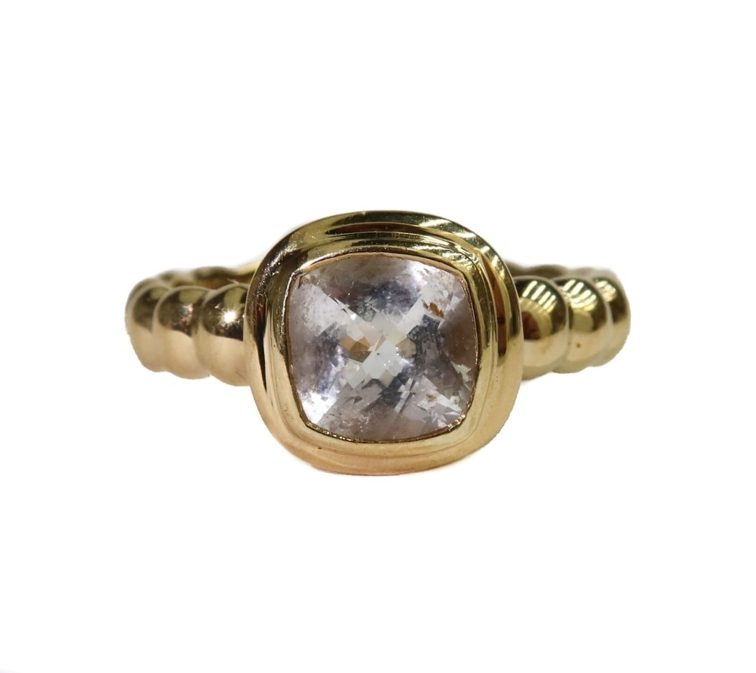 John Hardy 18k Yellow Gold Cushion Cut White Topaz Ring Size 7: John Hardy 18k yellow gold white topaz ring, size 7. Cushion cut white topaz center measuring approximately 8mm x 8mm x 4.4mm with a ribbed yellow gold band. Marked Hardy 18k to inner band. Weight: Ap