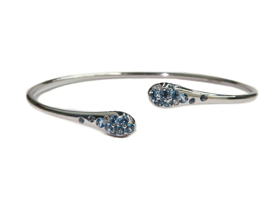 Italian 750 White Gold Ombre Via Fiori Scuri Blue Topaz Diamond Cuff Bracelet: Italian 750 White Gold Ombre Via Fiori Scuri Blue Topaz Diamond Cuff Bracelet Weight Approx., 4.8 grams Measures Approx., 6.5 inches circumference- can be adjusted Domestic Shipping: $25