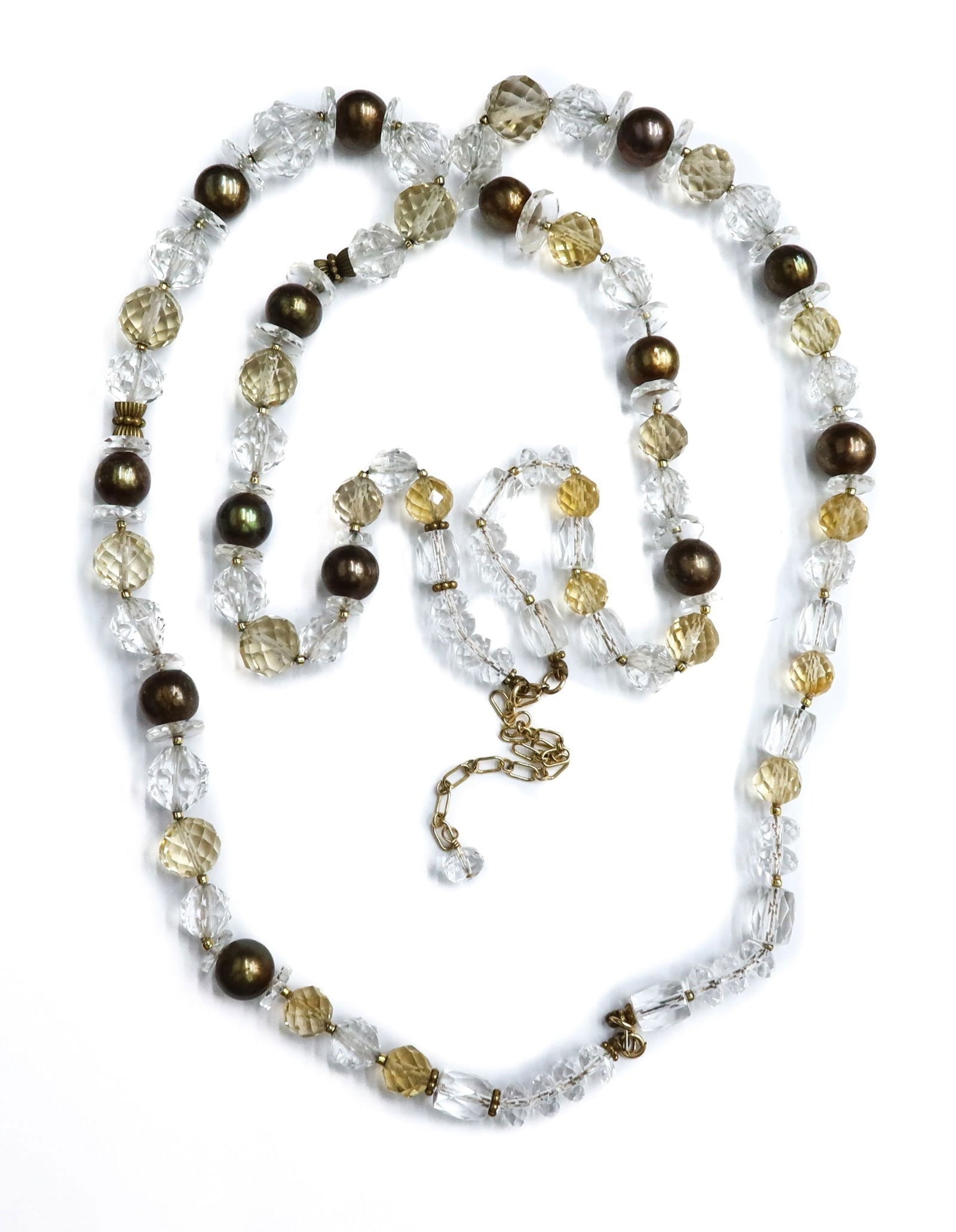 Clear Quartz and Brown Pearl Necklace: Clear Quartz and Brown Pearl Necklace. Various shaped clear quartz to strand with alternating brown cultured pearls measuring approximately 10.5mm. Weight Approx., 127 grams Measures Approx., 40 inche