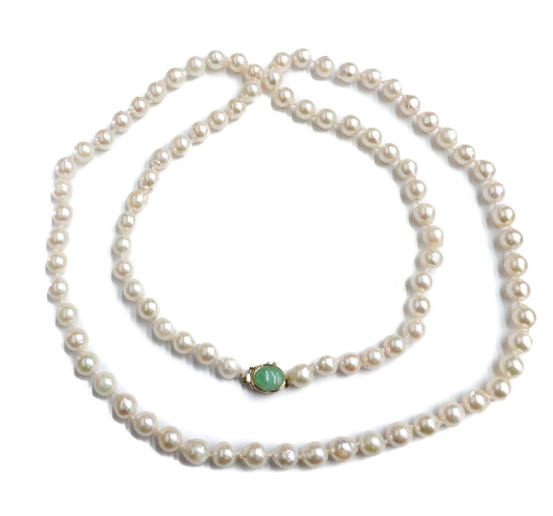 Gump's 14k Yellow Gold Jade and Freshwater Cultured Pearl Single Strand Necklace: Gump's 14k yellow gold jade and freshwater cultured pearl single strand necklace. The pearls measuring between 7.6mm to 7.9mm. Cabochon jade to clasp and marked 14 Gumps Weight Approx. 62.70 grams Mea