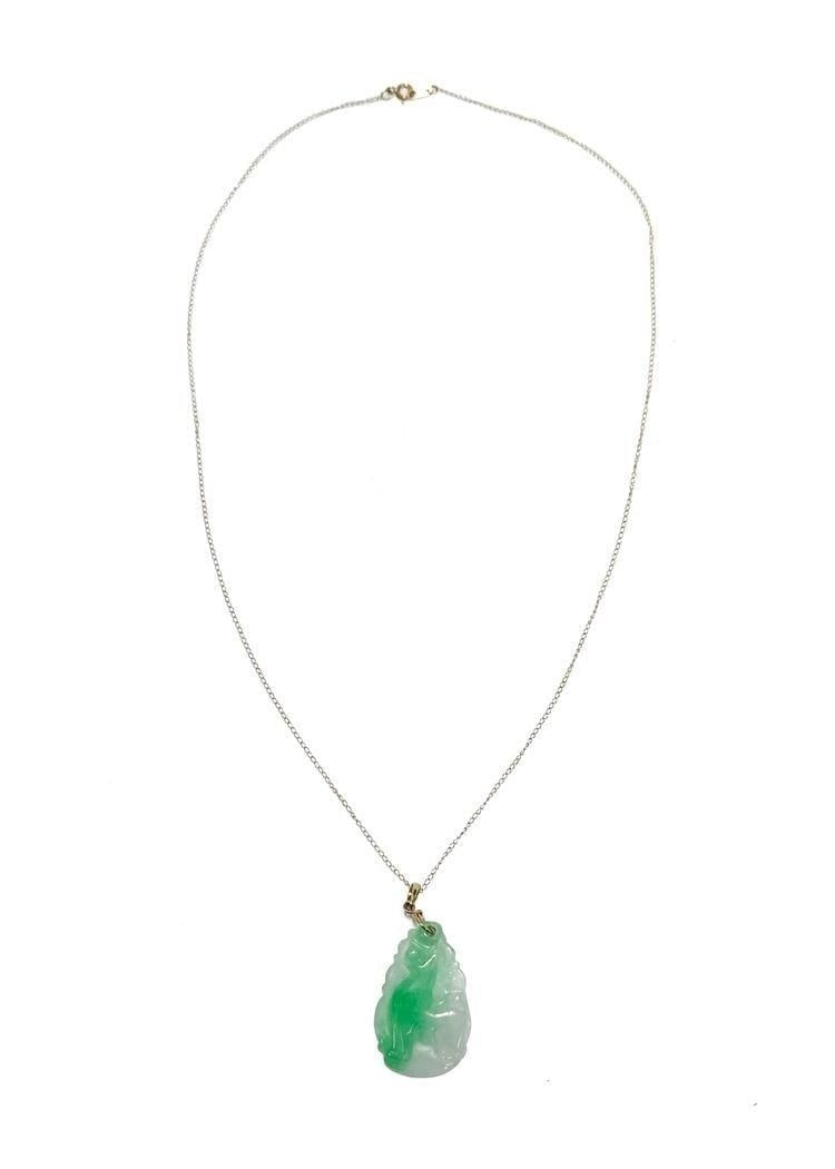 MS Co. 14k Yellow Gold and Jade Pendant Necklace: MS Co. 14k Yellow Gold and Jade Pendant Necklace. Carved Dog to the jade pendant. Marked "14k" to clasp. Weight Approx., 4.50 grams Measures Approx., 18 inches length / Pendant: 1.125 inches x 0.75 in