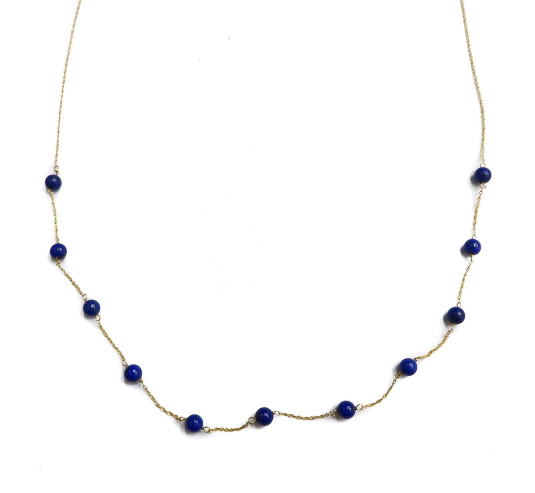 Milor Italian 14k Gold and Lapis Lazuli Single Strand Twisted Chain Necklace: Milor Italian 14k Gold and Lapis Lazuli Single Strand Twisted Chain Necklace. 11 lapis lazuli beads measuring approximately 4.20mm. Marked Milor 14k Italy to clasp. Weight Approx., 1.73 grams Measures
