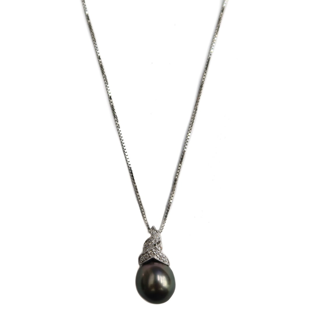 14k White Gold Black Pearl and Diamond Box Chain Necklace: 14k White Gold Black Pearl and Diamond Box Chain Necklace. Drop black pearl to pendant measuring approximately 11.3mm. 14 round cut diamonds to penant in a twirled ribbon design weighing approximately