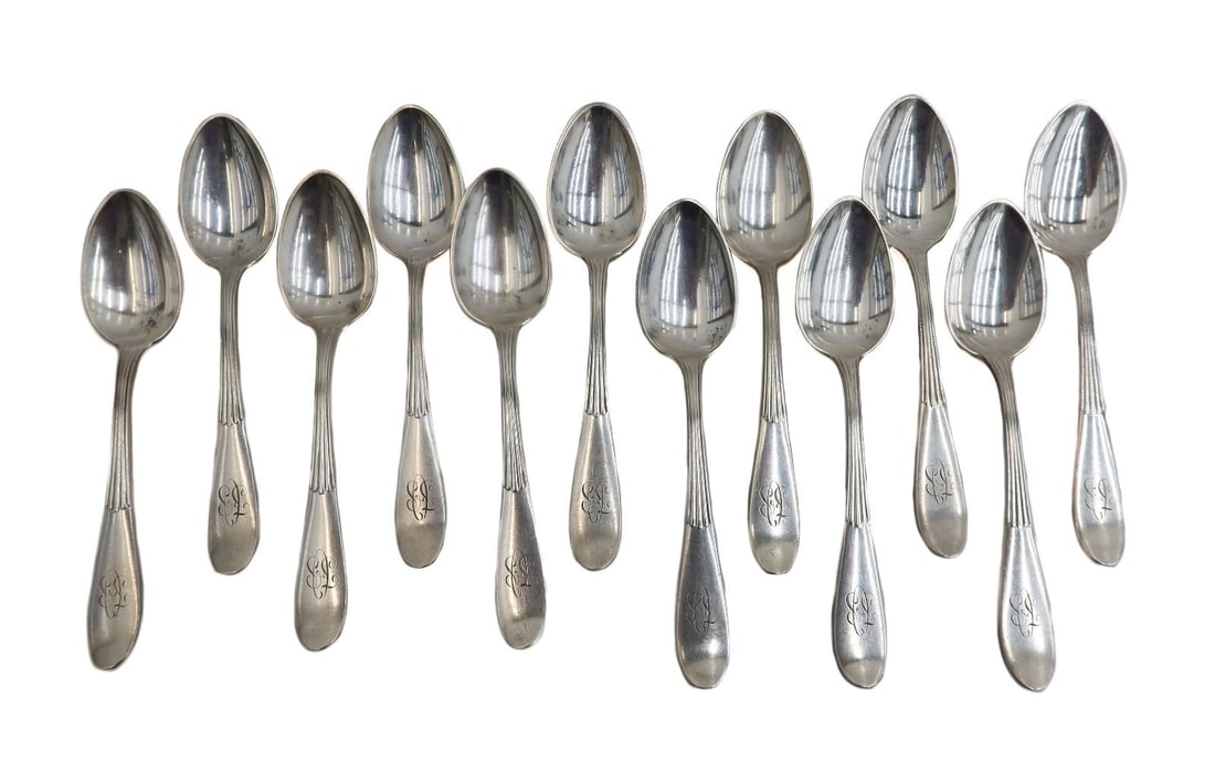 12 Tiffany & Co. Silverplate Table Spoons in Mount Vernon: 12 Tiffany & Co. silverplate table spoons in Mount Vernon. Half ribbed handles and a two letter monogram to edge. Tiffany & Co. sterling silver mark to verso. Weight: Approx. 1.3 lbs Measurements: App