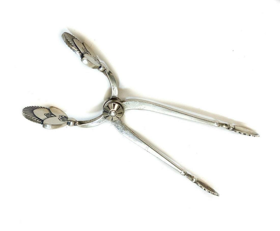 Georg Jensen Sterling Silver Modernist Sugar Cube Tongs in Cactus, c1930: Georg Jensen Sterling Silver Modernist Sugar Cube Tongs in Cactus, c1930. Georg Jensen sterling silver hallmarks to the handles. Weight: Approx. 25.1 grams Measurements: Approx. 4 inches length Condit