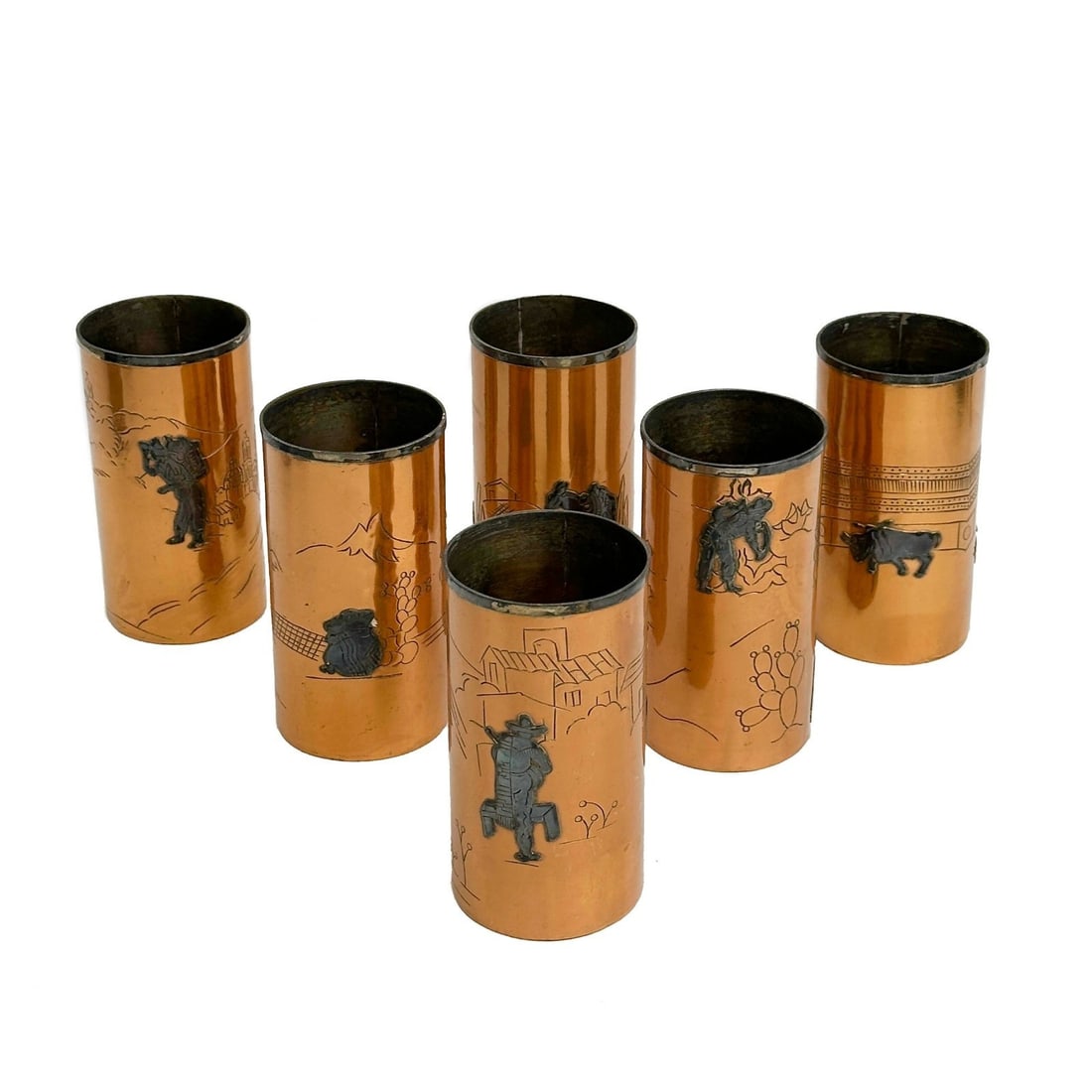 6 Victoria Taxco Mexico Applied Silver Copper Tumblers mid century 267: 6 Victoria Taxco Mexico Applied Silver Copper Tumblers, mid century. Copper body with applied silver desert scenes with figures to the sides. Underside marked Victoria Taxco Mexico 267. Weight: Approx
