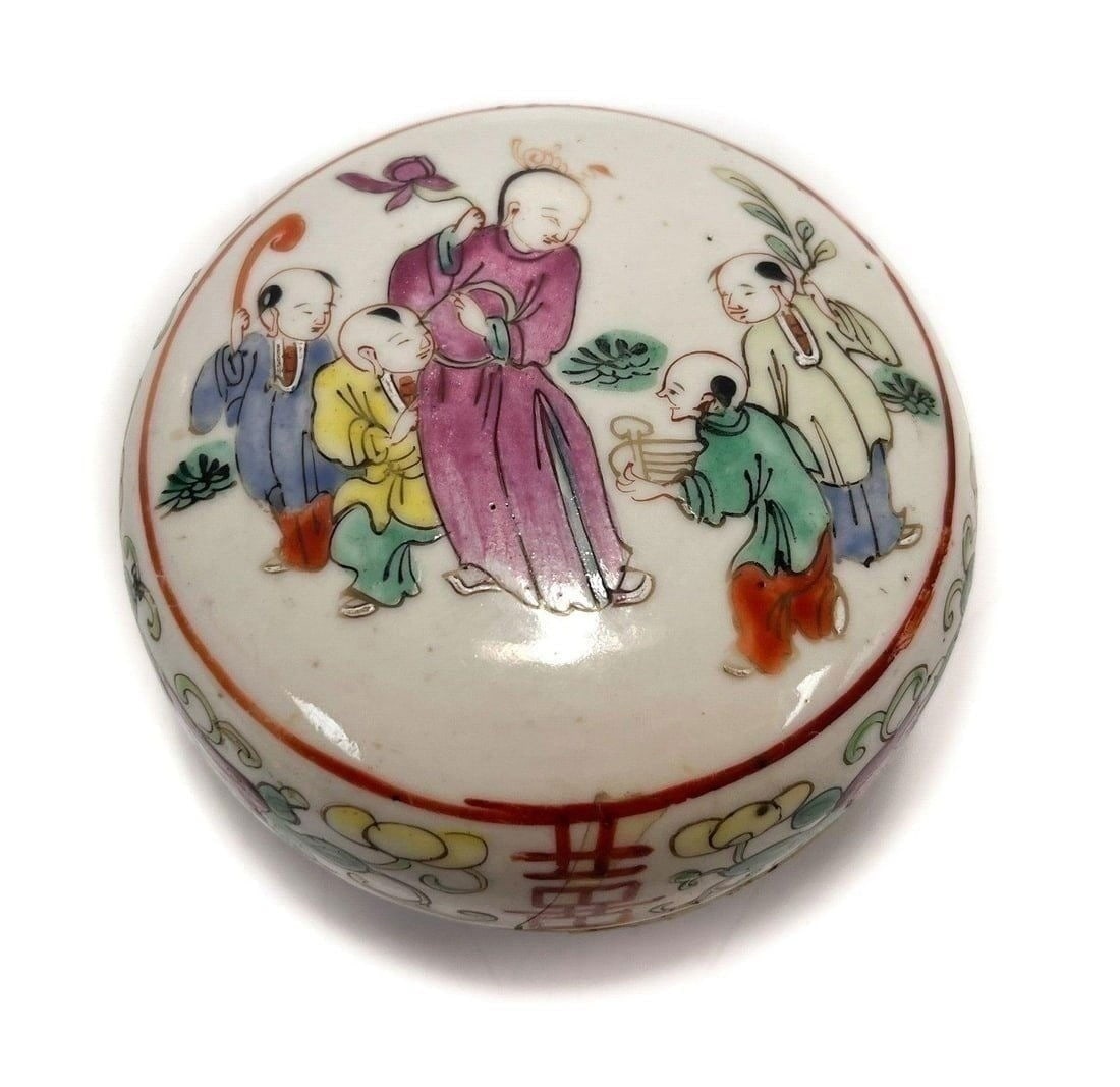 Chinese Porcelain Covered Round Box: Chinese Porcelain Covered Round Box . Enamel chinese figures to the lid with floral decoration. Chinese script to sides. Weight Approx., 1 lb / Measures Approx., 3.75 inches diameter x 2.5 inches tall