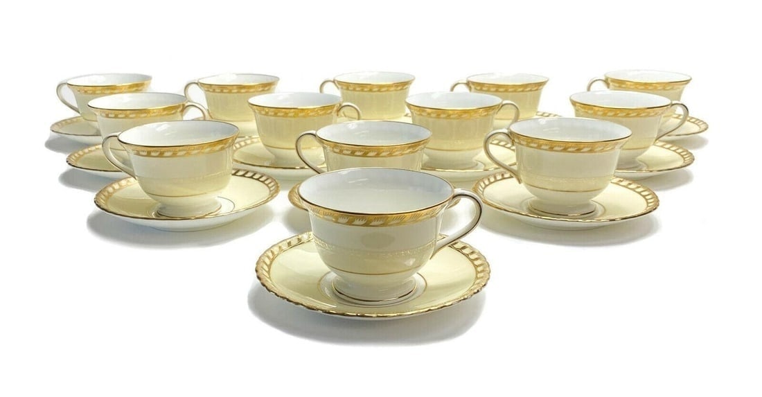12 + 1 Minton England Porcelain Cup and Saucers. Pale Yellow & Gilt: 12 plus a spare, Minton England porcelain cup and saucers. A pale yellow ground with gilt to the scalloped edges. Minton England mark to the underside base with various date mark periods. Weight Appro