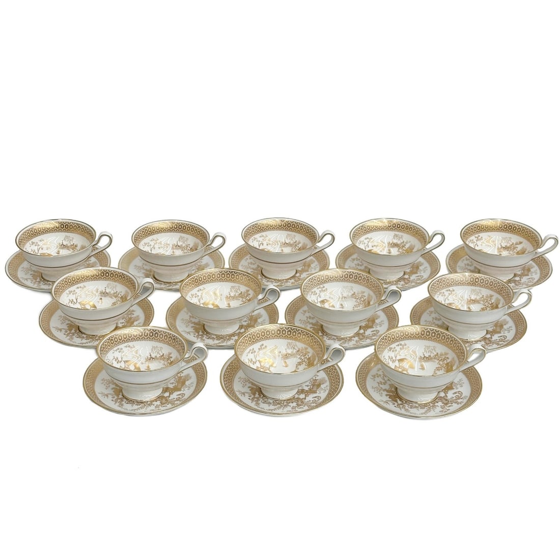 12 Copeland Spode Porcelain Tea Cup & Saucers in Spode's Garden Y7046 c1950: 12 Copeland Spode Gilt Porcelain Tea Cup & Saucers in Spode's Garden, circa 1950. A white ground with ornate gilt chinoiserie scenes to the center of figures fishing, geometric decoration to the edge.