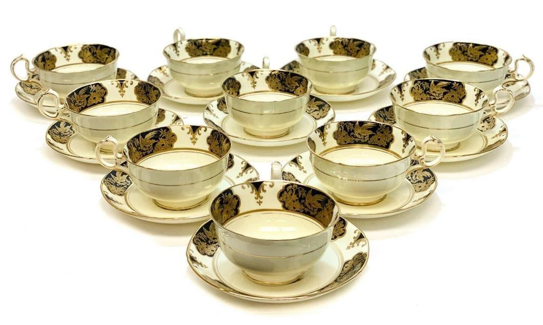 10 Westminster Series Tuscan England Gilt & Black Porcelain Cup & Saucers: 10 Westminster Series Tuscan Bone China England porcelain cup & saucers. A black ground with gilt bird designs throughout the rim of the saucer and around the top rim of the cup. Westminster series ma