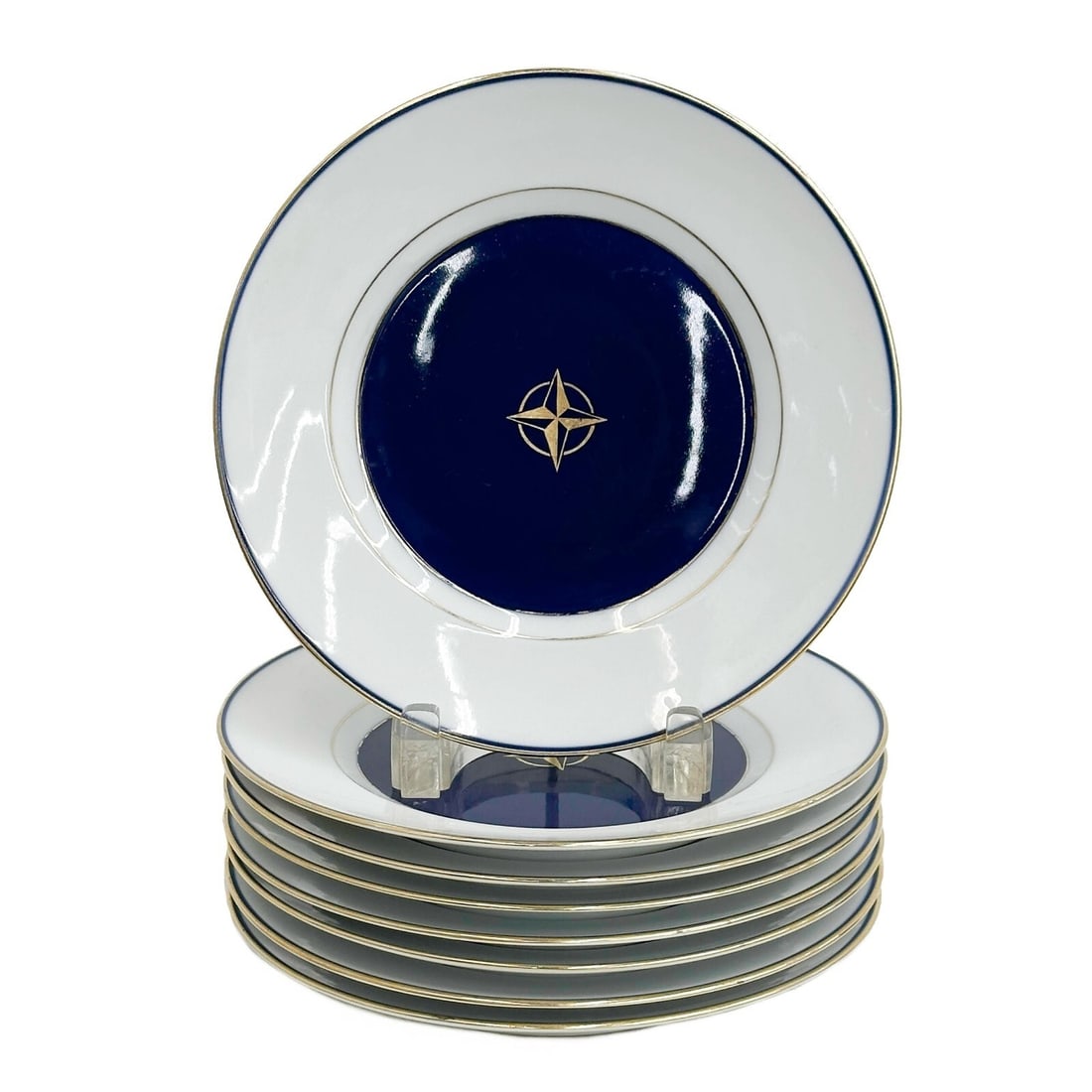 8 Royal Copenhagen Denmark Porcelain 8.6 in Plates #9589 circa 1900: 8 Royal Copenhagen Denmark Porcelain Plates, circa 1900. A cobalt blue ground to the center, gilt four pointed star. Underside marked Royal Copenhagen Denmark KFX 9589 Weight: Approx. 8 lbs Measuremen