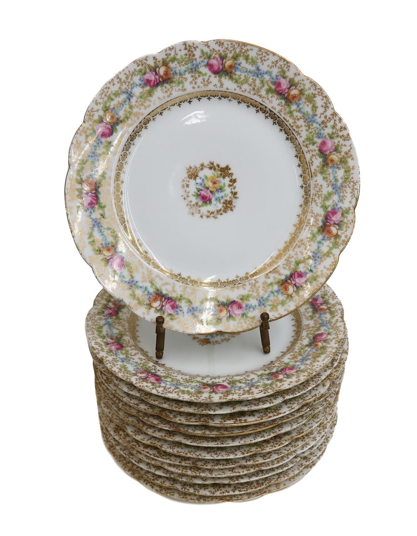 12 C. Ahrenfeldt France Depose Hand Painted Porcelain Dessert Plates c1900: 12 C. A. France Depose (C. Ahrenfeldt) hand painted porcelain scalloped dessert plates, circa 1900. Hand painted pink and yellow flower vines to scallop edge. Hand painted floral center with a gilt le