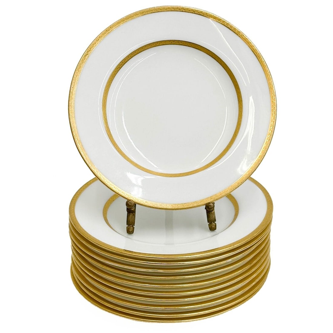 11 Minton England Gilt Porcelain Bread Plates 1915 G 8721: 11 Minton England Gilt Porcelain Bread Plates, 1915. Gilt decoration to the edge, underside marked Minton England G 8721 Weight: Approx. 4 lbs Measurements: Approx. 6.125 inches diameter Condition: Ut