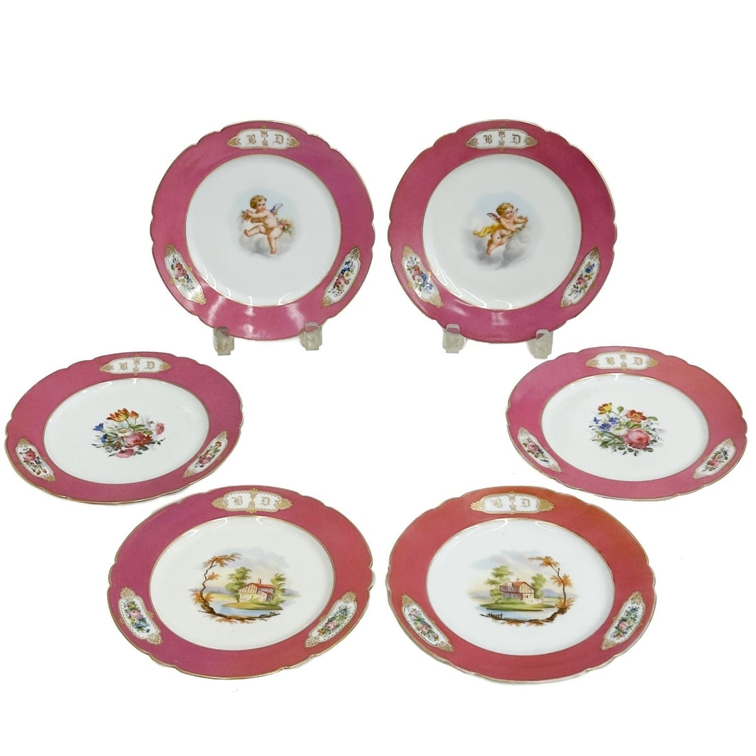 6 French Hand Painted Porcelain Plates Cherubs Landscapes Florals c1900: Set of 6 French Hand Painted Porcelain Plates, circa 1900. A pink ground to the edge with monogram to the edge. Hand painted scenes to center, 2 with cherubs, 2 with landscape scenes, and 2 with flora