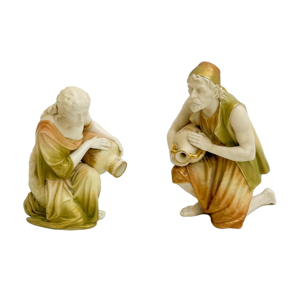 Pair Royal Worcester Porcelain Blush Ivory Figurines Water Jug Carriers c1905: Pair Royal Worcester Porcelain Blush Ivory Figurines. Depicts a man and a woman, each kneeling and holding a water jug. Royal Worcester marks to the underside for circa 1904. Weight: Approx. 2 lb Meas