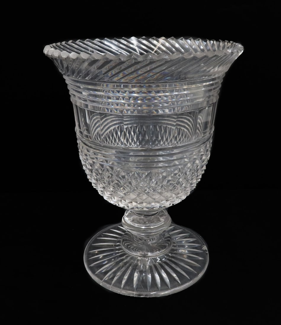 English Cut Glass Scallop Rimmed Footed Vase circa 1820: English cut glass scallop rimmed footed vase circa 1820. Cut glass crosshatched diamonds. Starburst underside to underside. Weight: Approx. 3 lbs Measurements: Approx. 6.125 inches diameter x 8 inches
