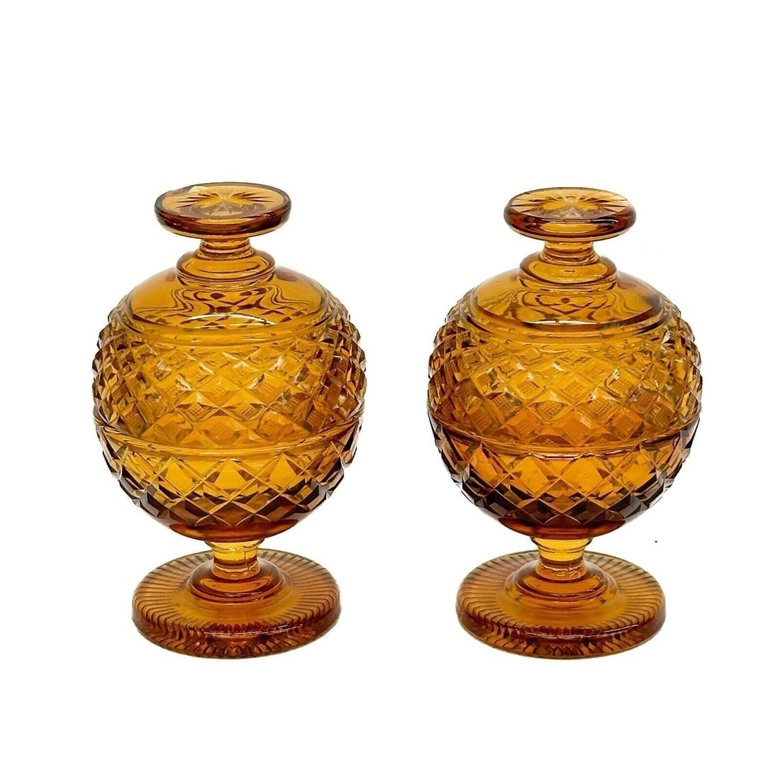 Pair English Amber Cut Glass Lidded Sweet Meat Candy Jars circa 1900: Pair English Amber Cut Glass Lidded Sweet Meat Candy Jars, circa 1900. Diamond cut decoration. Weight:approx. 3 lbs Measurements: Approx. 4 inches diameter x 6.5 inches tall Condition: chip to handle 