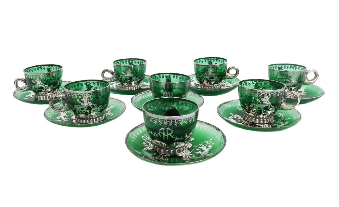 8 Murano Green Colored Glass and Silver Overlay Horse Juice Cup and Underplates: 8 Murano green colored glass and silver overlay juice cup and underplates. Silver overlay horses to the center with a monogram "AR" Weight: Approx. 2 lb Measurements: Approx. 4 inches x 3 inches diame